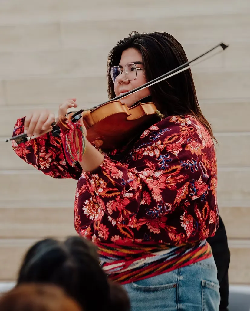 Brianna Lizotte playing fiddle