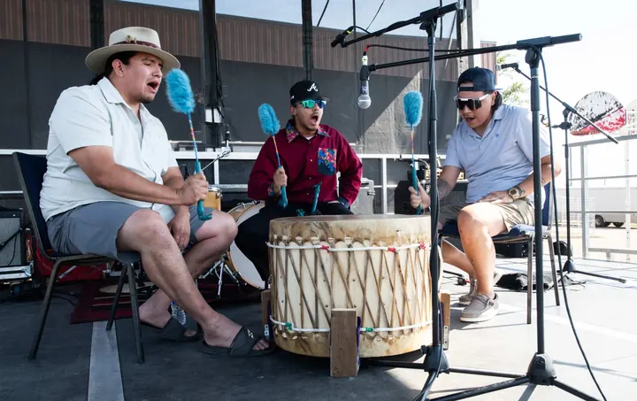 Performers drumming together during the 2025 festival