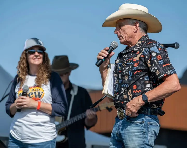 Community performers sharing the outdoor stage in 2025