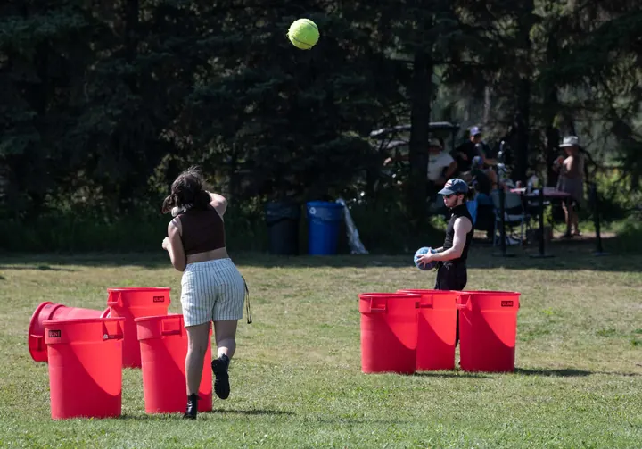 Festival guests playing a lawn game together in 2025