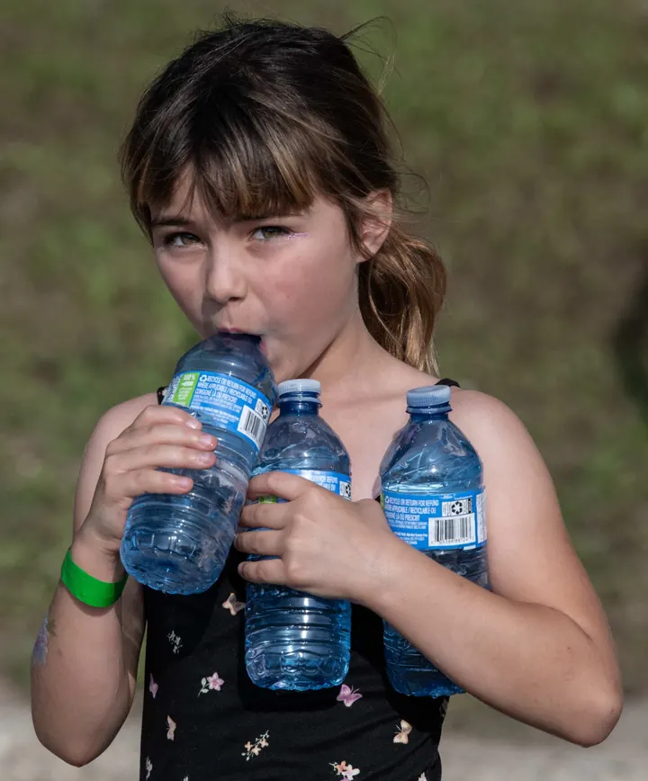 A child enjoying water play on the festival grounds in 2025